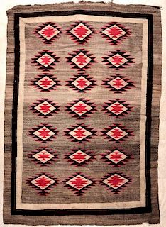 A LARGE NAVAJO RUG APPROXIMATELY 5.5 X 8 FEET