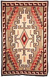 A LARGE NAVAJO RUG APPROXIMATELY 6 X 9 FEET