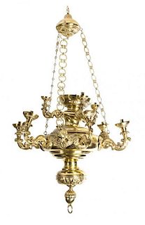 A Neoclassical Style Brass Nine-Light Chandelier Height 47 inches.