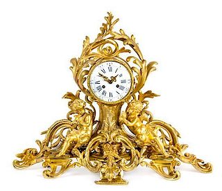 A Napoleon III Gilt Bronze Figural Mantel Clock Height 22 x width 25 inches.