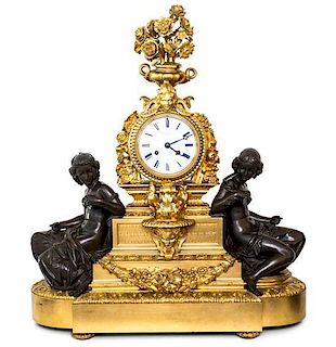 A Napolean III Gilt and Patinated Bronze Figural Mantel Clock Height 30 x width 26 x depth 12 1/2 inches.