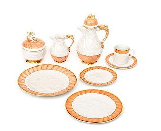 A Mottahedeh Porcelain Dinner Service for Twelve Diameter of luncheon plates 10 inches.
