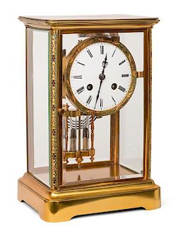 A French Brass and Glass Clock Height 10 1/2 inches.