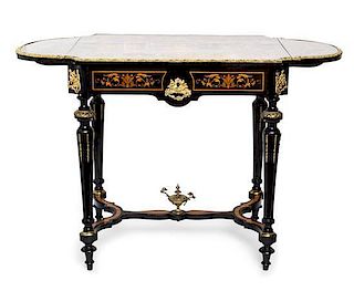 A Napoleon III Gilt Bronze Mounted Ebony and Marquetry Table Height 29 1/2 x width 43 1/2 x depth 22 1/4 inches.