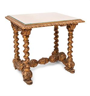 An Italian Giltwood Low Table Height 21 x width 24 x depth 21 inches.