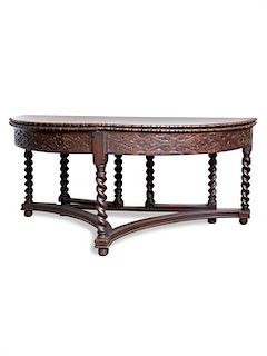 A Baroque Style Oak Gate-Leg Flip-Top Table Height 29 x width 62 x depth 29 inches.