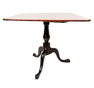 An English Mahogany Tilt-Top Tea Table Height 28 x width 32 1/2 x depth 32 1/2 inches.