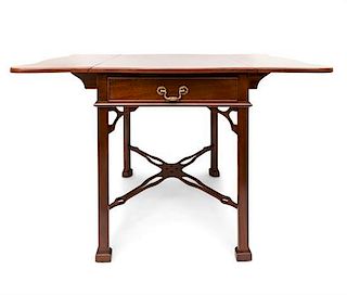 A Chippendale Style Mahogany Pembroke Table Height 28 3/4 x width 23 x depth 32 inches (closed).