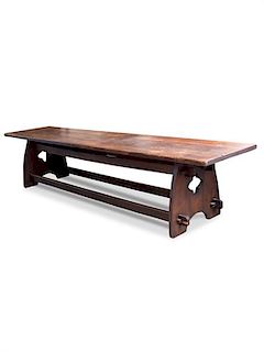 An American Arts & Crafts Oak Trestle Table Height 30 1/2 x width 144 x depth 30 inches.