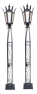 A Pair of Wrought Iron Torcheres Height 84 inches.