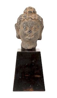 A Carved Stone Head of Buddha