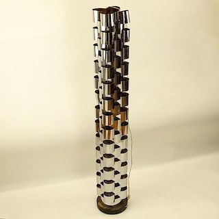 Curtis Jeré, American (20th C) Chromed metal and ebonized wood tall floor lamp.