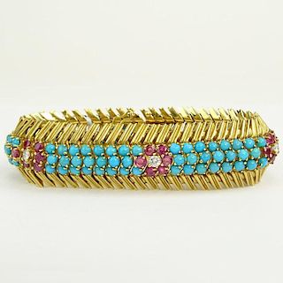 Circa 1950's 18 Karat Yellow Gold Bracelet Set with Round Cut Rubies, Diamonds and Persian Turquoise.