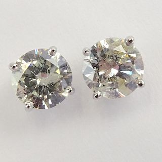 AIG Certified 1.57 Carat, total weight, Round Brilliant Cut Diamond and 14 Karat White Gold Earstuds.