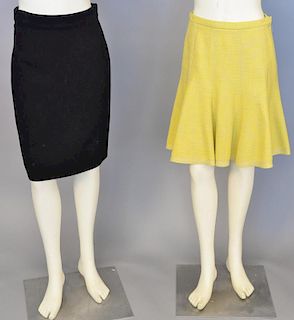 Two skirts including Louis Vuitton yellow skirt and a black Gianni Versace Couture skirt.