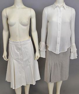 Three women's Oscar de la Renta pieces including silk blouse, cashmere skirt, and a cotton skirt.