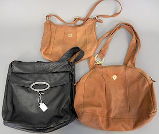 Three leather bags including Carolina Herrera tan leather handbag, Pierre Balmain tan leather purse...