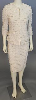 St. John two piece tweed suit, cream colored knit with novelty yarns jacket and skirt.