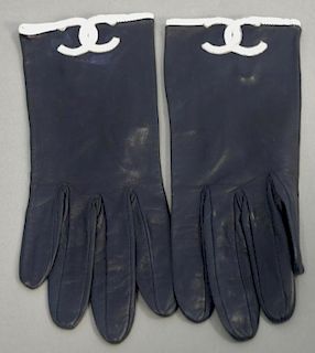 Pair of Chanel navy blue and white leather gloves.