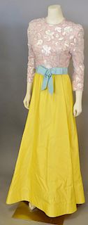 Scaasi, c. 1980, Evening gown with A-line skirt constructed of bright yellow satin and bodice of pink silk damask embellished...
