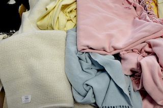 Six throw blankets, two are Faribo, a Ralph Lauren, two pink cashmere? with fringe ends, and a blue cashmere?