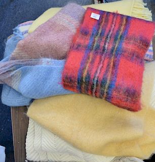 Six throw blankets or shawls including Eskimo wool, The Three Weavers yellow wool, two Royal Stewart Liberty of London shawl, and Churchill Weavers ha