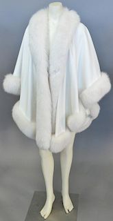 White wool knit wrap / cape with white fur trim.