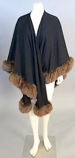 Black cashmere/wool wrap or cape with brown fur trim.
