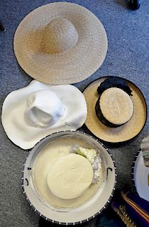 Four straw hats including Giorgio Armani new with tag (retail $170), Whittall and Shon, Carolyne Roehm, and Eric Javits Lily J.