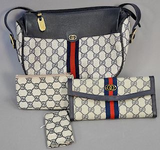 Gucci Boston blue canvas handbag with matching wallet, change purse, and key holder.