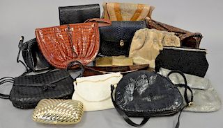 Large group of vintage purses to include two beaded purses, nine snakeskin purses, one alligator black leather, and three small gold purses.