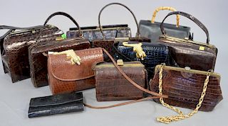Eleven vintage alligator handbags and purses.
