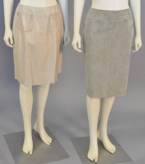 Chanel two piece skirt lot including tan leather skirt and olive green suede skirt.