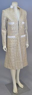Custom designer womens gold and silver long coat with silk liner.
