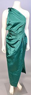 Christian Dior, Autumn/Winter 1979, Evening dress of dark emerald green silk satin. The skirt is wrapped across the front and pleated up into the wais
