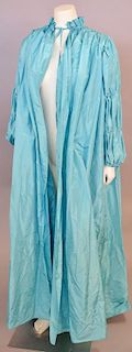 Christian Dior, Spring/Summer 1981, Summer coat of turquoise silk, with gathered shoulders and drawstrings in sleeves to create three tiers of puffing