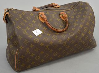 Louis Vuitton vintage brown monogram canvas bag with leather handles.
