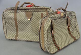 Pair of vintage authentic Gucci Monogram canvas and leather soft sided suitcases / luggage.