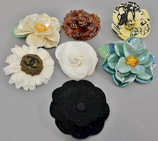 Seven Chanel Camelia Rose flower corsage/pin/brooches, three plastic, three cloth, and one felt.