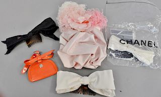 Chanel lot to include three Chanel barrettes, a bowtie pin, and a luggage tag.