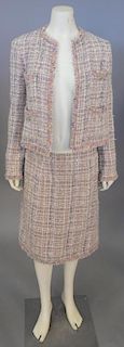 Chanel two piece tweed suit, brown with colored accents throughout including jacket and skirt.