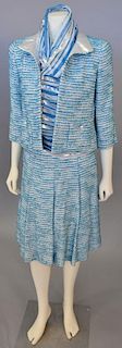 Chanel three piece tweed suit, white and blue with silver accents including jacket, skirt, and silk sleeveless shirt.