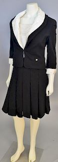 Chanel wool two piece suit including a black strapless cross back dress with silk ivory pleated...
