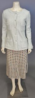 Chanel two piece tweed group with pale green jacket and green skirt.
