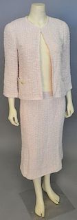 Chanel two piece tweed/novelty weave suit with pale pink jacket and matching skirt.