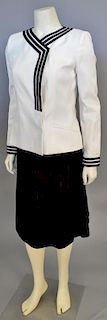 Chanel two piece suit, ivory matelasse jacket with black stripe trim and black skirt.