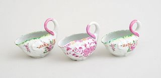 THREE DERBY FLORAL-DECORATED LEAF-MOLDED PORCELAIN SMALL SAUCEBOATS