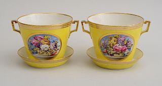 PAIR OF DERBY YELLOW-GROUND PORCELAIN TWO-HANDLED CACHEPOTS AND STANDS