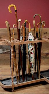 MISCELLANEOUS GROUP OF WALKING STICKS AND A LADY'S PARASOLS