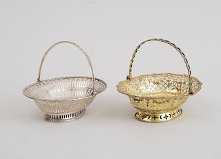 GEORGE III CRESTED SILVER SWEETMEAT BASKET AND A GEORGE III SILVER-GILT SWEETMEAT BASKET